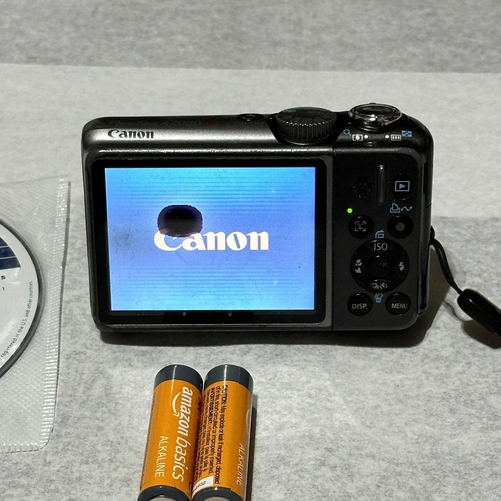 Canon PowerShot A2000 IS 10MP Digital Camera Pink For Parts Or Repair Lens Error